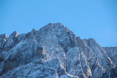 Scenic view of mountains against clear blue sky