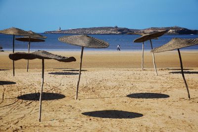 Scenic view of beach against clear sky