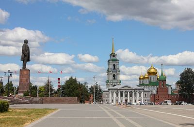 View of buildings against cloudy sky