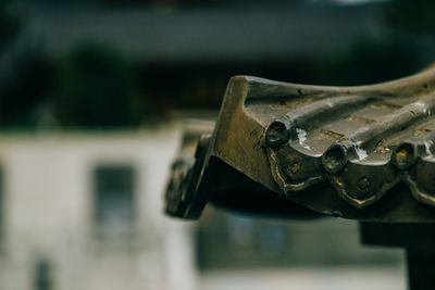 Close-up of old rusty metal on wood