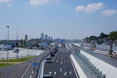 High angle view of highway in city against sky