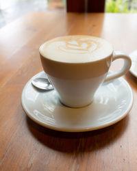 Close-up of coffee cup on table