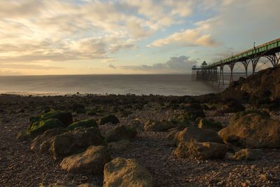 View of bridge over sea against cloudy sky