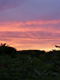 Scenic view of silhouette landscape against sky during sunset