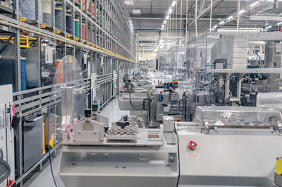 Interior of industrial workshop or shop inside for production of automotive wiring.