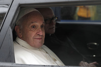 Portrait of man sitting in car