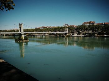 Scenic view of bridge against clear blue sky