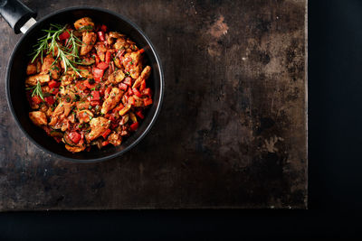 High angle view of chopped vegetables in bowl on table