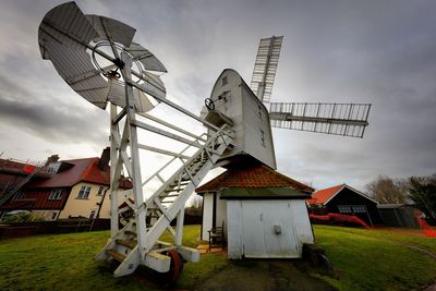 Traditional windmill against sky