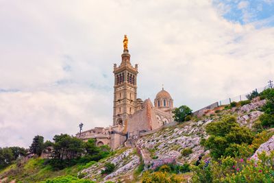 Historic building against cloudy sky