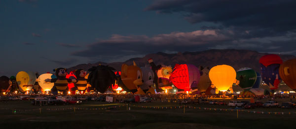 Hot air balloons illuminate the evening for a night glow celebration