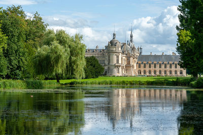 Amazing water reflection of chantilly castle during summer time. 