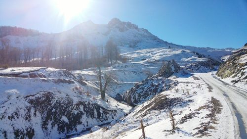 Scenic view of snowcapped mountains against sky