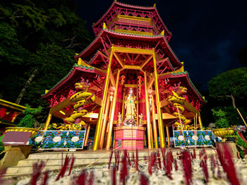 Low angle view of illuminated temple building
