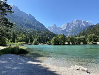 Scenic view of lake and mountains against sky
