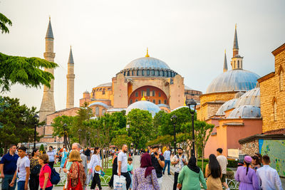 People in front of historic building