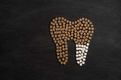 High angle view of heart shape over black background