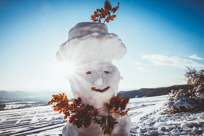 Snowman against sky
