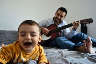 Father and son playing