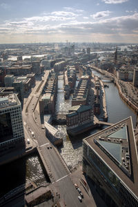 High angle view of bridge over river amidst buildings in city