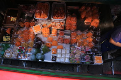 Man for sale at market stall