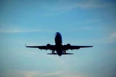 Low angle view of airplane flying in sky