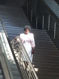 Low angle view of man standing on staircase