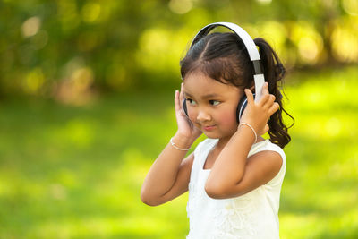 Portrait of cute girl standing outdoors