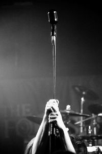 Low angle view of man playing guitar at night