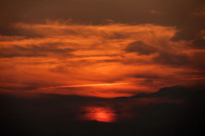 Scenic view of dramatic sky during sunset