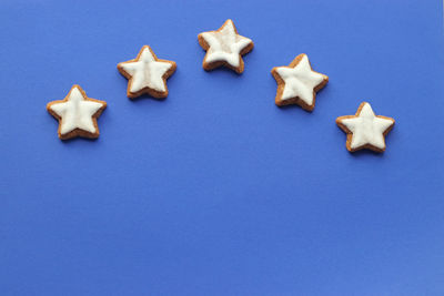 High angle view of cookies against blue background