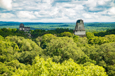 Scenic view of castle on field against sky