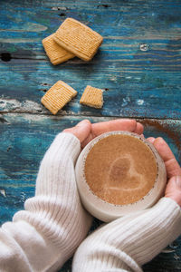 Close-up of hand holding ice cream