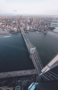 High angle view of bridge over river and buildings in city