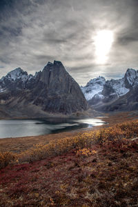 Scenic view of snowcapped mountains against sky during winter