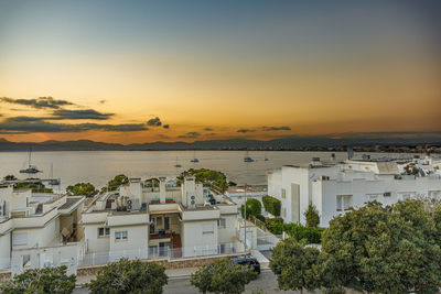 High angle view of townscape against sky during sunset