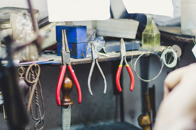 Hand tools hanging on shelf