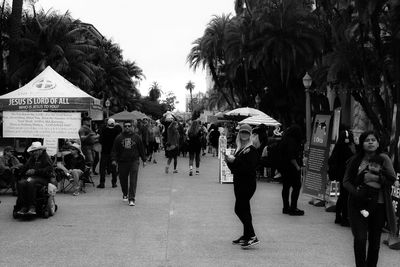 People walking on street in city