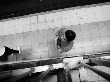 High angle view of boy playing in swimming pool