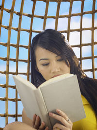 Young woman reading book