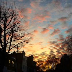 Low angle view of buildings at sunset