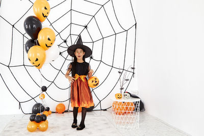 Portrait of a smiling girl holding umbrella