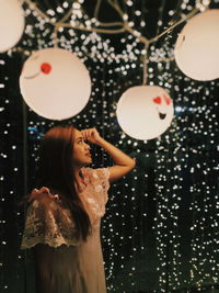 Portrait of a young woman with balloons