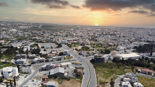 High angle view of vehicles on road amidst buildings in city