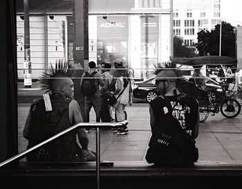 Woman sitting in city