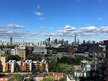 Buildings against cloudy sky