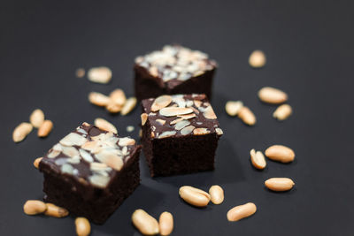 Close-up of chocolate cake on table against black background