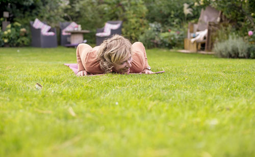 Man sleeping on grass in park