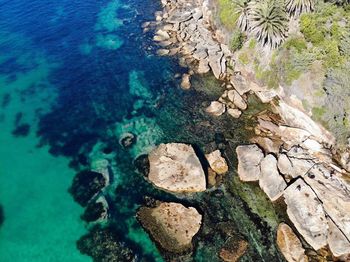 High angle view of rock formation in sea