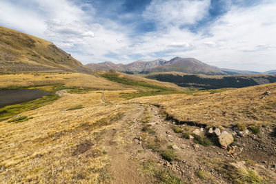 Hiking path with mount evans in the distance